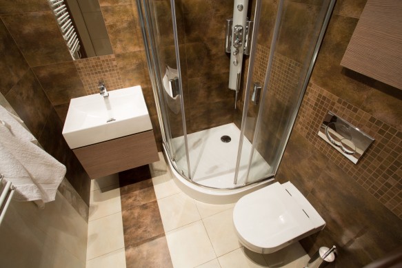 38199719 - view from the top of small bathroom with brown tiles