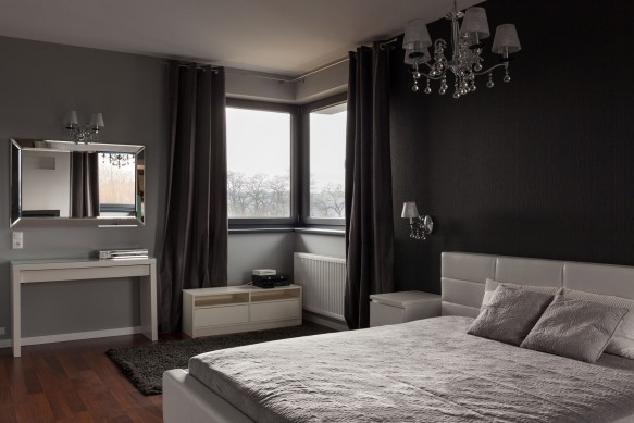 40260270 - dark expensive bedroom with black and grey walls